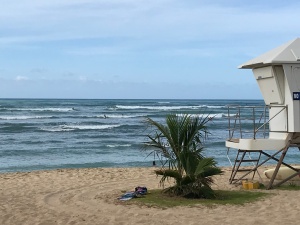 Image of White Plains Beach 2-4-foot surf swells in June 2019 with life guard shack in foreground. | The-Military-Guide.com